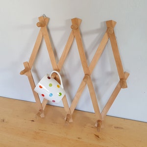 Folding peg rack for mugs, wood, accordion kitchen rack