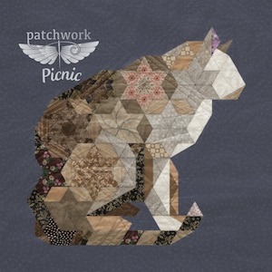 May include: A patchwork cat design in brown, white and grey tones. The cat is sitting with its tail curled around its body. The design includes the text "patchwork" and "Picnic".