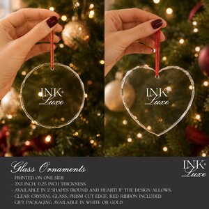 May include: Two clear crystal glass ornaments with prism-cut edges, one circular and one heart-shaped, each featuring the white text INK & LUXE. Each ornament hangs from a red ribbon and measures 7.62 cm by 7.62 cm with 0.64 cm thickness.