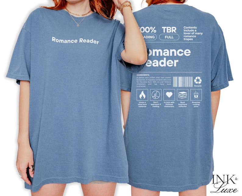 May include: A blue t-shirt with the text "Romance Reader" on the front and a list of romance tropes on the back. The shirt is made of a soft, comfortable material and is perfect for everyday wear.