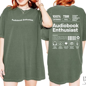 May include: A green t-shirt with the text "Audiobook Enthusiast" printed on the front. The back of the shirt has the text "100% TBR Audiobook Enthusiast" with a list of icons and text describing the contents of the audiobook.
