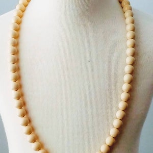 Vintage Trifari Crown lucite cream color bead necklace