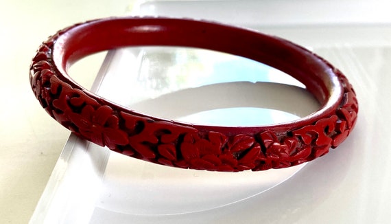 Vintage cinnabar bangle bracelet carved red flora… - image 1
