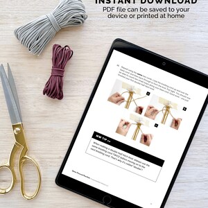 May include: A digital tablet displaying a tutorial for a double half hitch knot. The tutorial includes a step-by-step guide with illustrations and a tip on how to make the knot. The text on the tablet reads "PATTERN IS AN INSTANT DOWNLOAD PDF file can be saved to your device or printed at home".