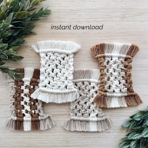 May include: Four handmade macrame coasters with fringe. Two coasters are white with brown accents, and two coasters are brown with white accents. The coasters are arranged on a wooden surface. The text "instant download" is visible in the image.