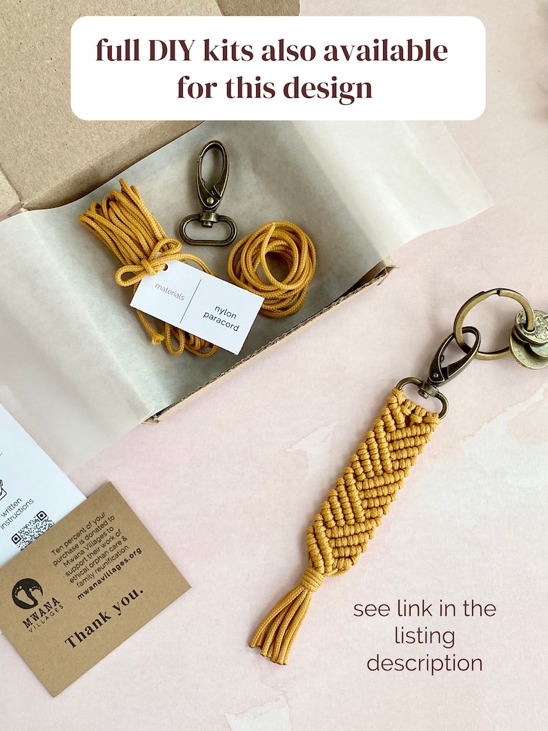 May include: A yellow paracord keychain with a chevron pattern and a tassel. The keychain is in a box with a spool of yellow paracord and a metal clasp. The text "full DIY kits also available for this design" is at the top of the image. The text "materials nylon paracord" is on a small brown card in the box. The text "see link in the listing description" is at the bottom of the image.
