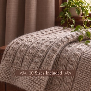 May include: A light beige knitted blanket featuring a textured pattern of vertical columns and small raised knots. A dark brown rectangular overlay is centered on the blanket with the white text "10 Sizes Included" flanked by small leaf illustrations.