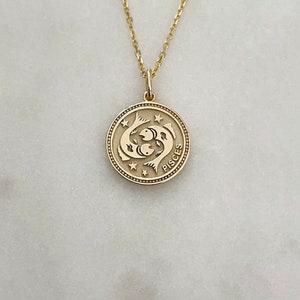 Signo del zodiaco Piscis en oro amarillo de 14 quilates