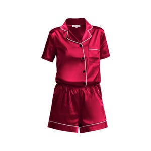 May include: A red satin short sleeve pajama set with white piping and black buttons.