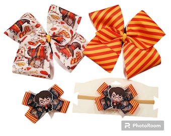 May include: Three hair bows with a Harry Potter theme. One bow is red and yellow striped, one is white with a Harry Potter print, and one is a smaller bow with a Harry Potter character print. The bows are on a white background.