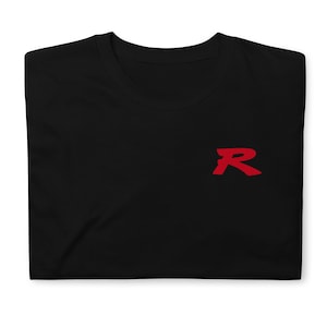 May include: Black t-shirt with a red "R" on the front.