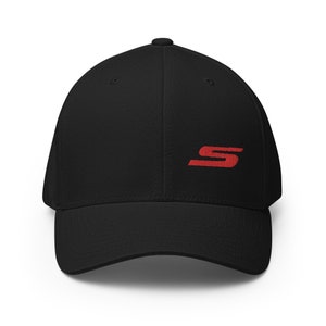 May include: A black baseball cap with a red embroidered letter 'S' on the front.