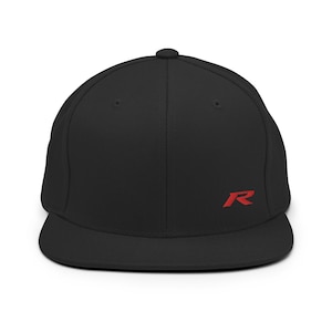 May include: A black and red flat brimmed baseball cap with a red embroidered letter "R" on the front.