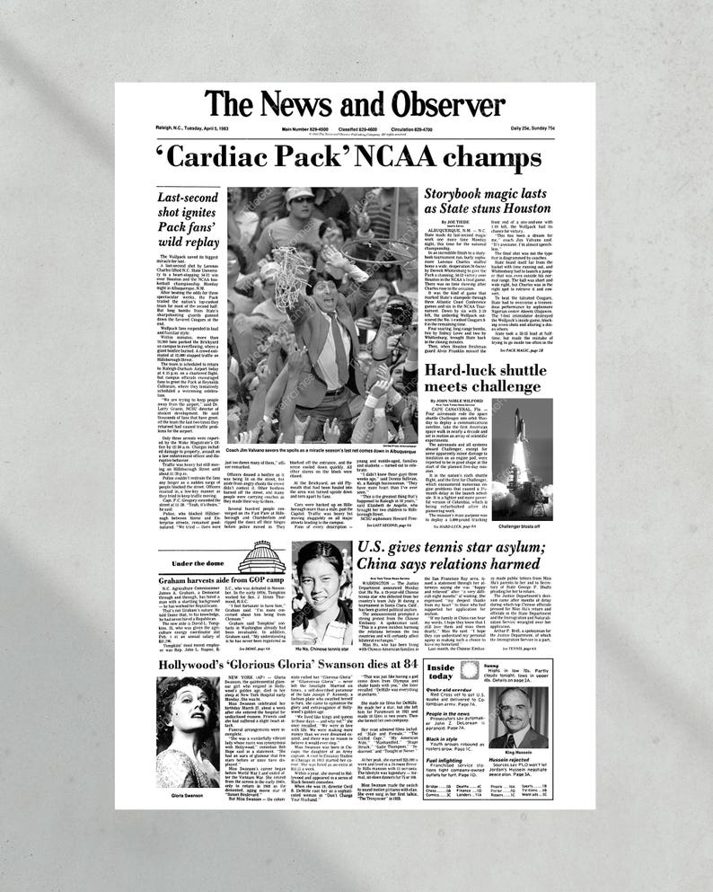 May include: A black and white newspaper front page with the headline "'Cardiac Pack' NCAA champs". The article discusses the University of North Carolina's victory in the NCAA men's basketball championship. Other articles include a story about the space shuttle Challenger, a story about a tennis player seeking asylum in the United States, and an obituary for actress Gloria Swanson.