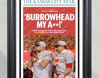 May include: Framed newspaper front page from The Kansas City Star. Headline: 'BURROWHEAD MY A**!' with Chiefs 23, Bengals 20 score. Image shows two football players celebrating. Black frame, white matting.