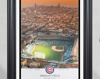 May include: An aerial view of Wrigley Field, home of the Chicago Cubs, with the city skyline in the background. The image shows the baseball field, the stands, and the surrounding neighborhood. The Cubs logo is prominently displayed in the lower right corner. The text "Wrigley Field, Chicago, Illinois" is also visible.