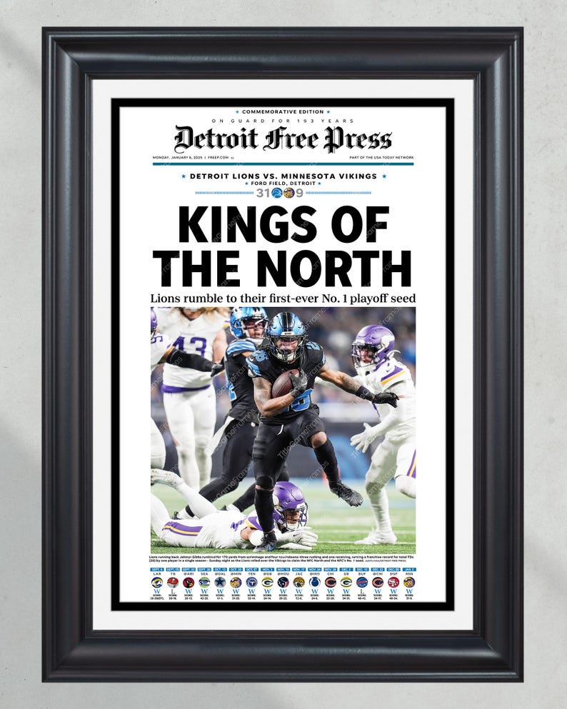 May include: Framed Detroit Free Press newspaper front page. Headline: "KINGS OF THE NORTH." Image shows a football game between the Detroit Lions and Minnesota Vikings. The score is 31-09. The frame is black.
