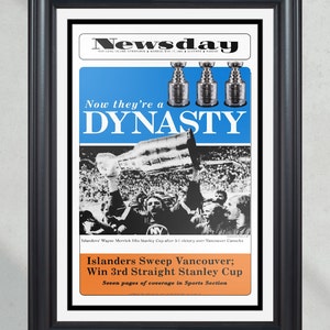 May include: A vintage newspaper headline announcing the New York Islanders winning their third consecutive Stanley Cup championship. The headline reads "Now they're a DYNASTY" with a photo of the team celebrating. The text below the headline reads "Islanders Sweep Vancouver; Win 3rd Straight Stanley Cup. Seven pages of coverage in Sports Section."