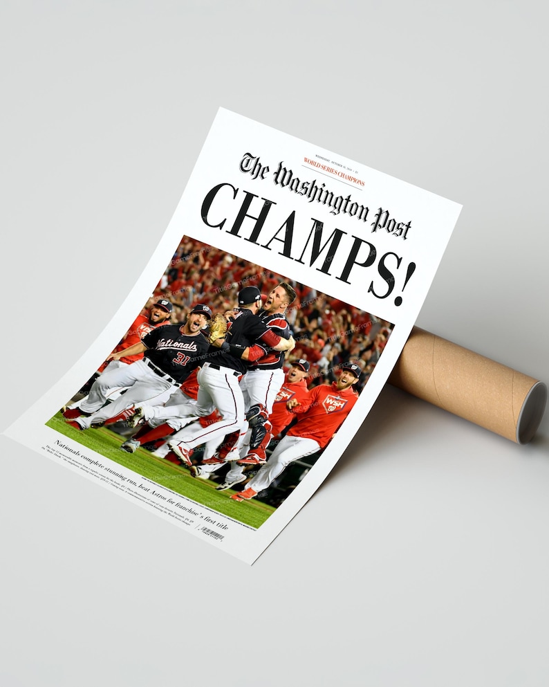 May include: A newspaper headline from The Washington Post reads "CHAMPS!" with a photo of the Washington Nationals baseball team celebrating their World Series victory. The headline also reads "WORLD SERIES CHAMPIONS".