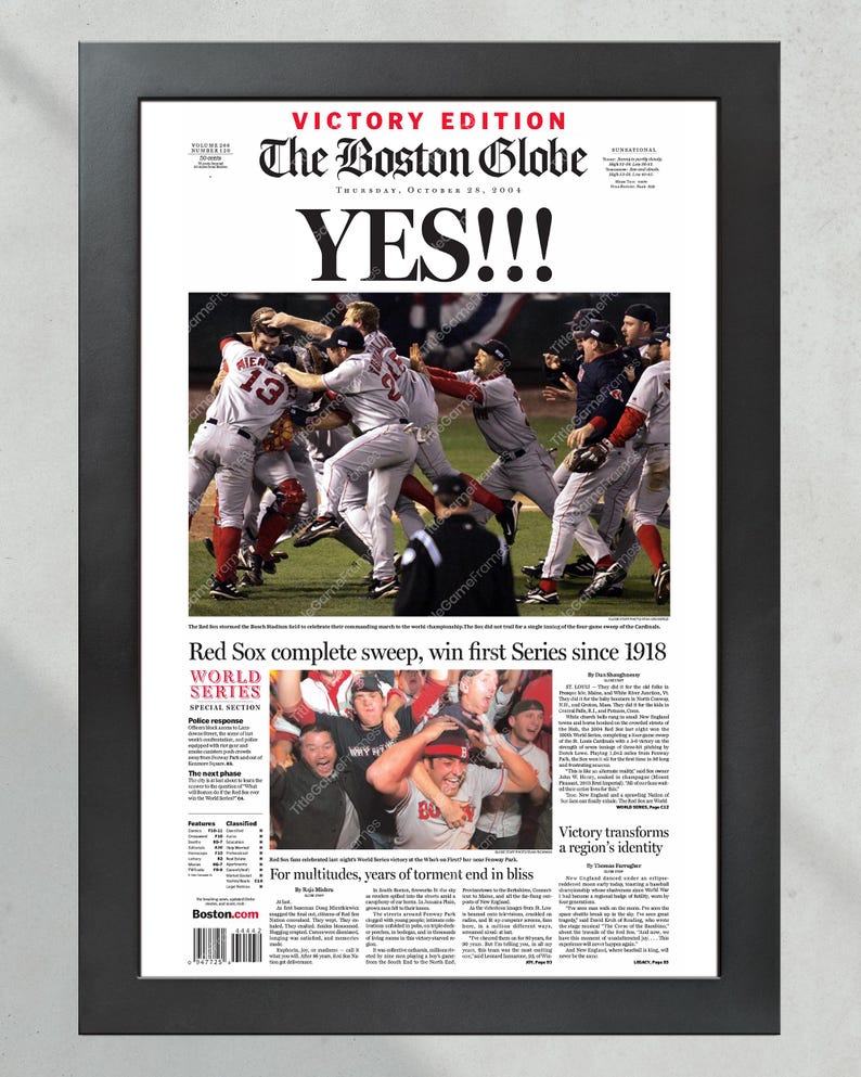 May include: Framed print of The Boston Globe newspaper from October 28, 2004, with the headline "YES!!!" and a photo of the Red Sox celebrating their World Series win. The text reads "Red Sox complete sweep, win first Series since 1918."