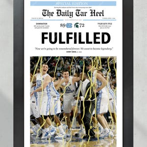 May include: A special edition newspaper front page from The Daily Tar Heel, celebrating the University of North Carolina's 89-72 victory over Michigan State in the 2009 NCAA Men's Basketball Championship. The headline reads "FULFILLED" with the quote "Now we're going to be remembered forever. We want to become legendary." by Danny Green. The image shows the UNC players celebrating on the court, covered in confetti.