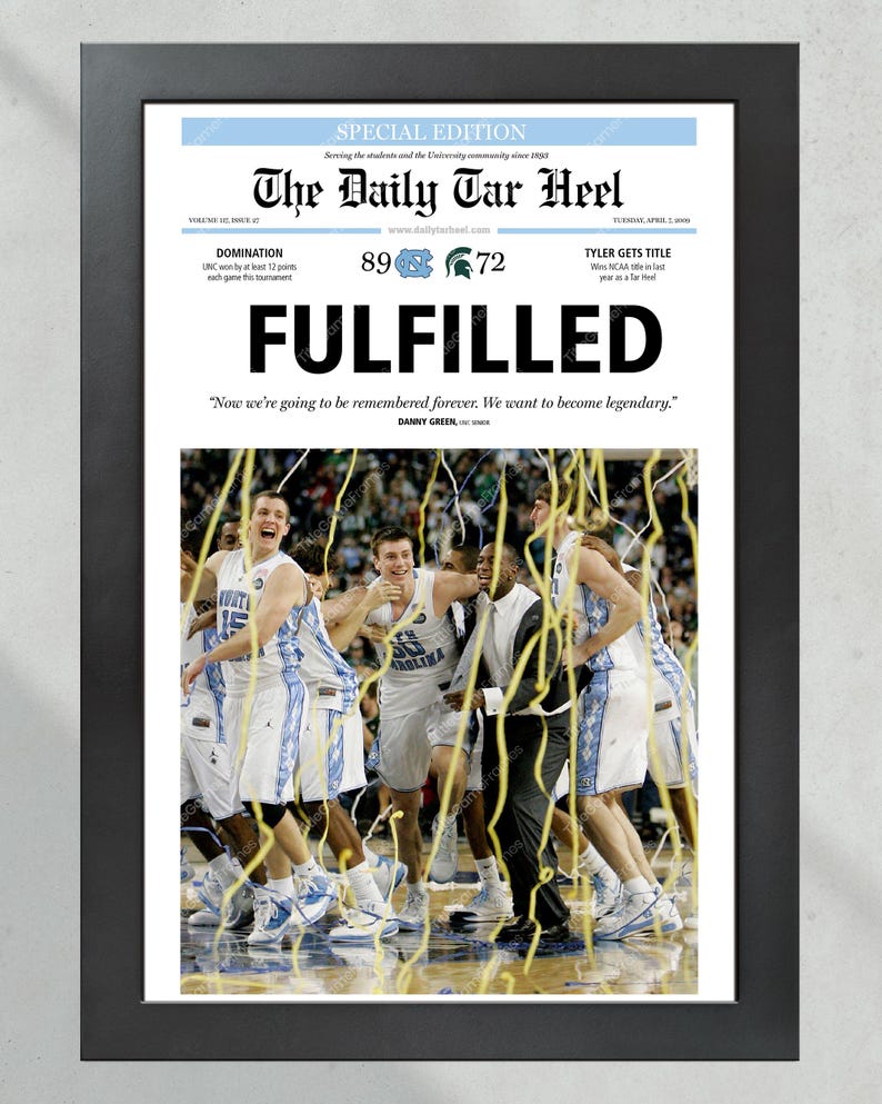 May include: A special edition newspaper front page from The Daily Tar Heel, celebrating the University of North Carolina's 89-72 victory over Michigan State in the 2009 NCAA Men's Basketball Championship. The headline reads "FULFILLED" with the quote "Now we're going to be remembered forever. We want to become legendary." by Danny Green. The image shows the UNC players celebrating on the court, covered in confetti.