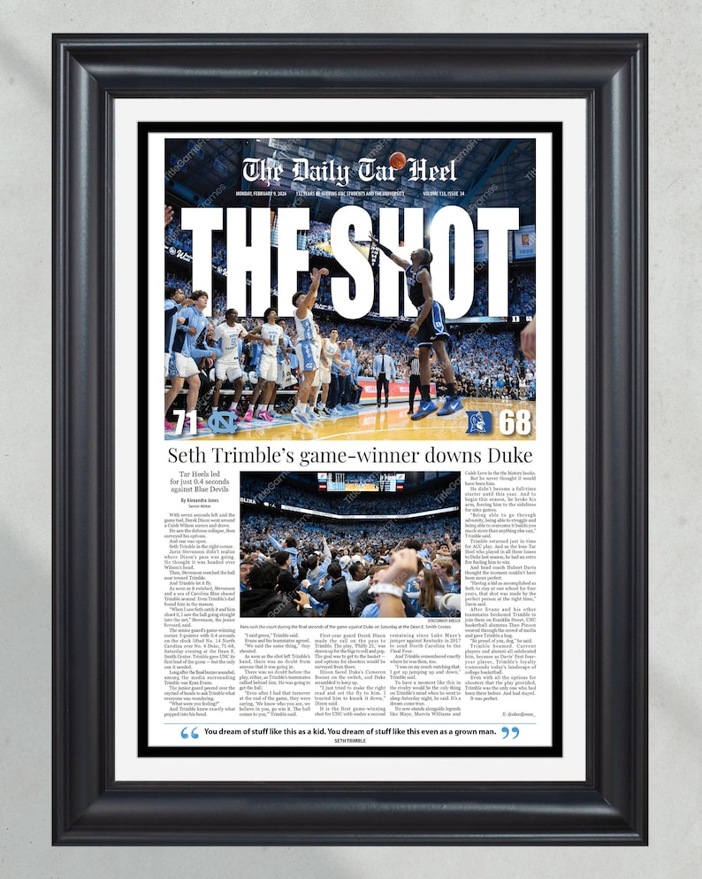 May include: Framed print of a newspaper front page titled "The Daily Tar Heel" with the headline "THE SHOT." The image shows a basketball game with the score 71-68. The text reads "Seth Trimble's game-winner downs Duke."