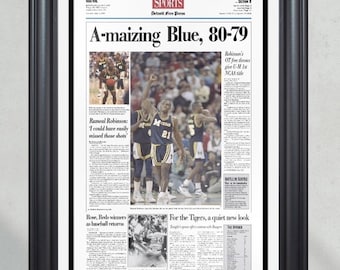 Portada de periódico enmarcada de los Michigan Wolverines, campeones de baloncesto universitario de la NCAA de 1989.