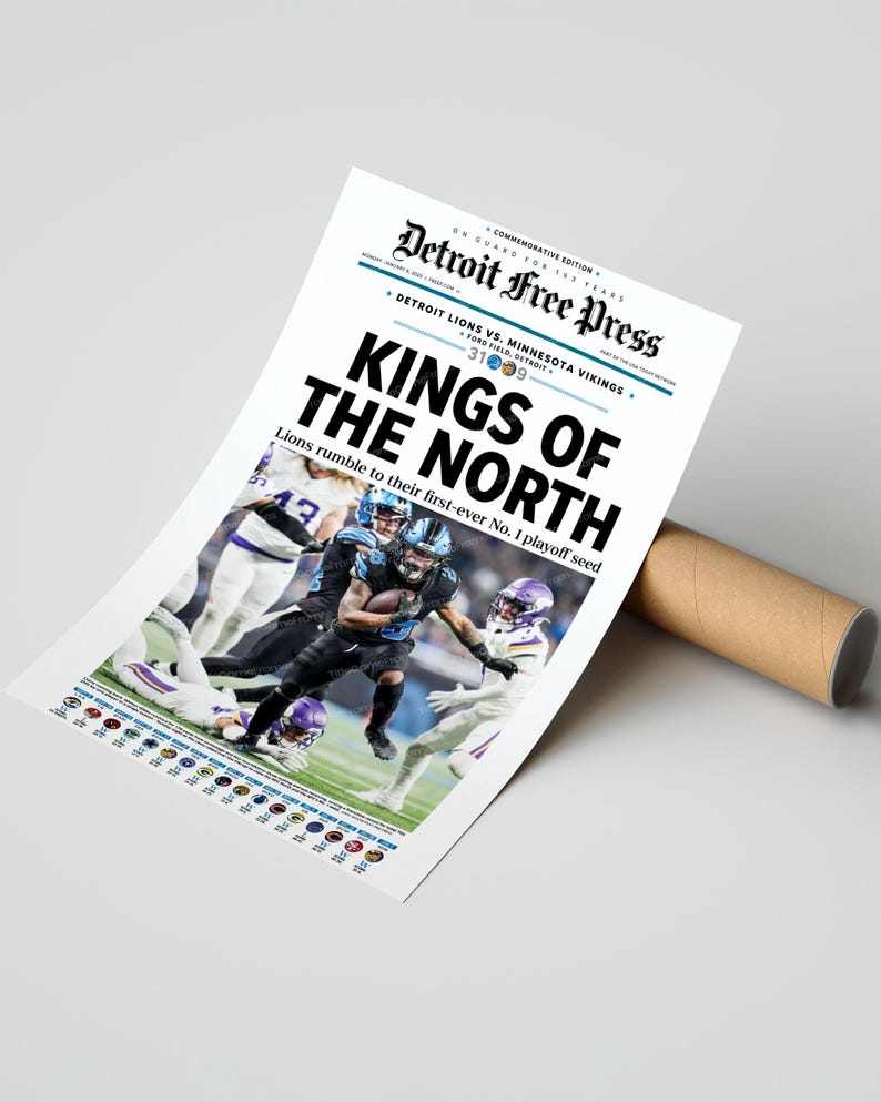 May include: A commemorative edition Detroit Free Press newspaper print. The headline reads "KINGS OF THE NORTH" with a photo of a football game. The text "Detroit Lions vs. Minnesota Vikings" is also visible. The print is rolled up with a brown cardboard tube.