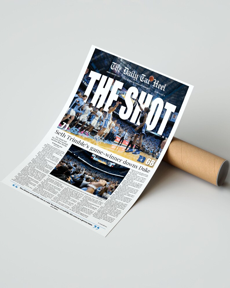May include: A newspaper print titled "The Shot" featuring a basketball game image. The headline reads "The Daily Tar Heel". The article highlights Seth Trimble's game-winning shot against Duke. The print is rolled up with a brown cardboard tube.