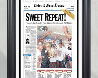 Portada de periódico enmarcada con la imagen de los Detroit Pistons, campeones de la NBA en 1990. Bad Boys.