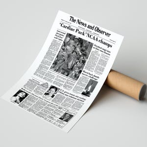 May include: A black and white newspaper clipping from The News and Observer with the headline "Cardiac Pack' NCAA champs". The article discusses the State University of New York at Stony Brook men's basketball team's victory over the University of Houston in the 1991 NCAA Men's Division I Basketball Tournament.