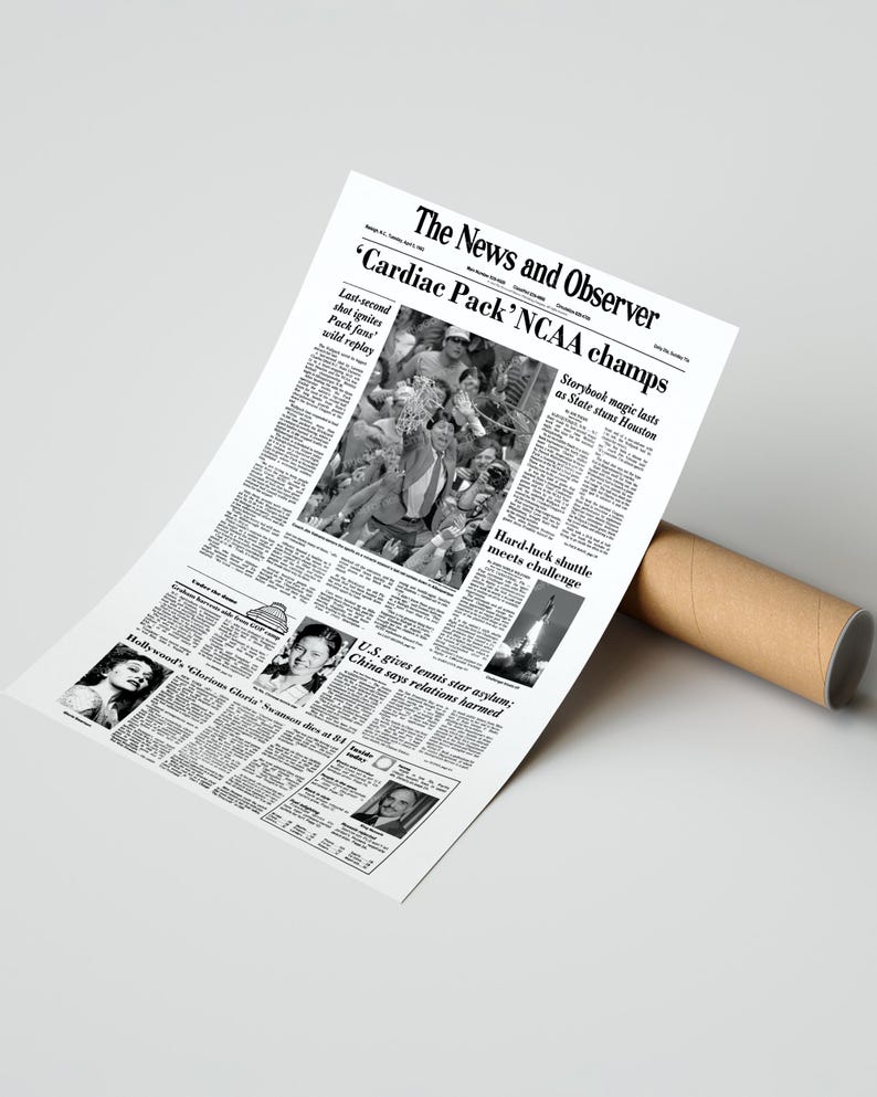 May include: A black and white newspaper clipping from The News and Observer with the headline "Cardiac Pack' NCAA champs". The article discusses the State University of New York at Stony Brook men's basketball team's victory over the University of Houston in the 1991 NCAA Men's Division I Basketball Tournament.