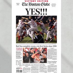May include: A newspaper front page from The Boston Globe, a Victory Edition, with the headline "YES!!!" and a photo of baseball players celebrating. The article announces the Red Sox's World Series win, their first since 1918.