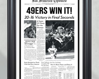 May include: A black and white newspaper clipping from the San Francisco Chronicle dated January 23, 1989, with the headline "49ERS WIN IT!" and the subheading "20-16 Victory in Final Seconds". The image shows a photo of a football player celebrating a victory.