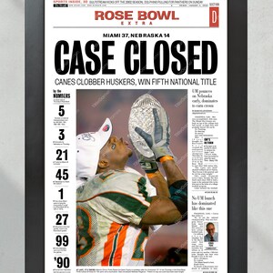 May include: A newspaper front page with the headline "CASE CLOSED" in bold black letters. The subheading reads "CANES CLOBBER HUSKERS, WIN FIFTH NATIONAL TITLE". The image shows a football player holding up a trophy. The newspaper is from the 2002 Rose Bowl game.
