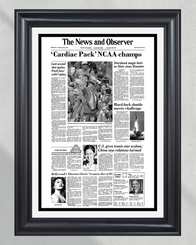 May include: A black and white newspaper front page from April 2, 1999, with the headline "'Cardiac Pack' NCAA champs". The article discusses the NCAA basketball championship game, where the North Carolina State Wolfpack defeated the University of Houston Cougars. Other articles on the page include "Storybook magic lasts as State stuns Houston", "Hard-luck shuttle meets challenge", and "U.S. gives tennis star asylum; China says relations harmed".