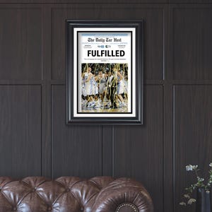 May include: A framed newspaper clipping from The Daily Tar Heel, dated March 30, 2009, with the headline "FULFILLED". The image shows a group of basketball players celebrating on the court.