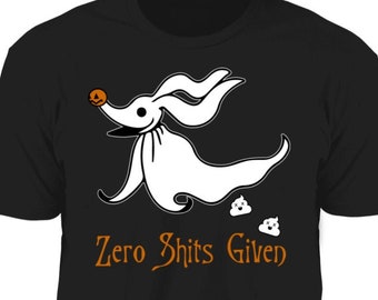 May include: Black t-shirt with a white cartoon dog wearing a pumpkin on its head. The dog is running and leaving behind two white poop emojis. The text "Zero Shits Given" is printed in orange below the dog.