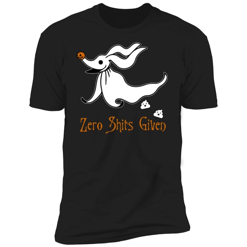 May include: Black t-shirt featuring a white cartoon dog wearing a pumpkin on its head. The dog is running and leaving behind two white poo emojis. The text "Zero Shits Given" is printed in orange below the dog.