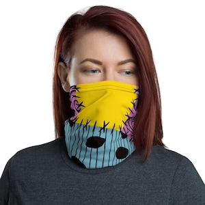 May include: A yellow, pink, and blue face mask with a stitched pattern. The mask is made of a soft, breathable fabric and is perfect for everyday wear.