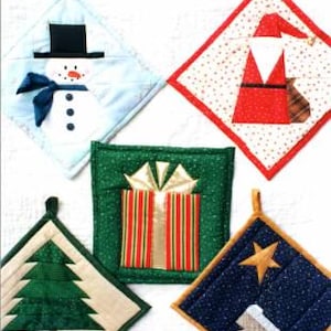 May include: A collection of five quilted Christmas-themed pot holders. Designs include a snowman, Santa Claus, a wrapped gift, a Christmas tree, and a nativity scene with a star. Each pot holder has a loop for hanging and is made of various fabrics.