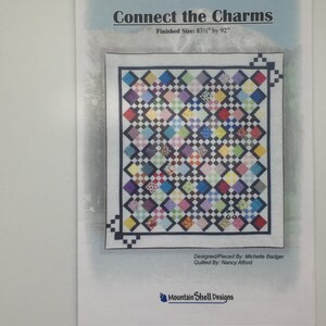 May include: A quilt pattern titled "Connect the Charms" with a finished size of 83 1/2 inches by 92 inches. The pattern features a colorful quilt design with a variety of fabrics and colors. The quilt is designed and pieced by Michelle Badger and quilted by Nancy Alford. The pattern is from Mountain Shell Designs.