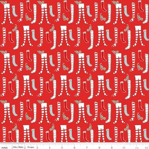 May include: Red fabric with a repeating pattern of white and red striped stockings with a green sprig of holly at the top.  There are also smaller blue stockings with white stripes.