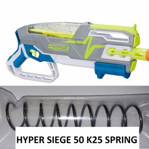 May include: A gray and blue Nerf Hyper Siege 50 K25 spring replacement part. The spring is packaged in a clear plastic bag with the text "HYPER SIEGE 50 K25 SPRING" printed on the bag.