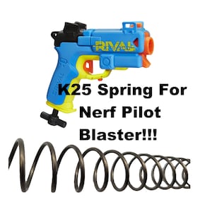 May include: A blue and yellow Nerf Rival K25 spring for a Nerf Pilot blaster. The spring is black and coiled.
