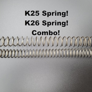 May include: Two silver metal springs, one on top of the other, with the text "K25 Spring! K26 Spring! Combo!" above them.