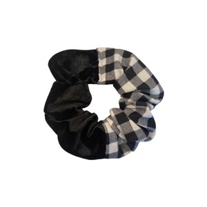 May include: Black and white checkered scrunchie with a black velvet section.