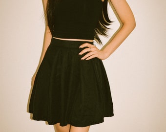Black pleated mini skirt