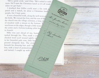 May include: A vintage green bookmark with the text "The Golden Krone" and "The old-fashioned charm of Tranghvani" printed on it. The bookmark also includes the text "Mr. Jonathan Hooker" and "Date: 3rd May 1893".